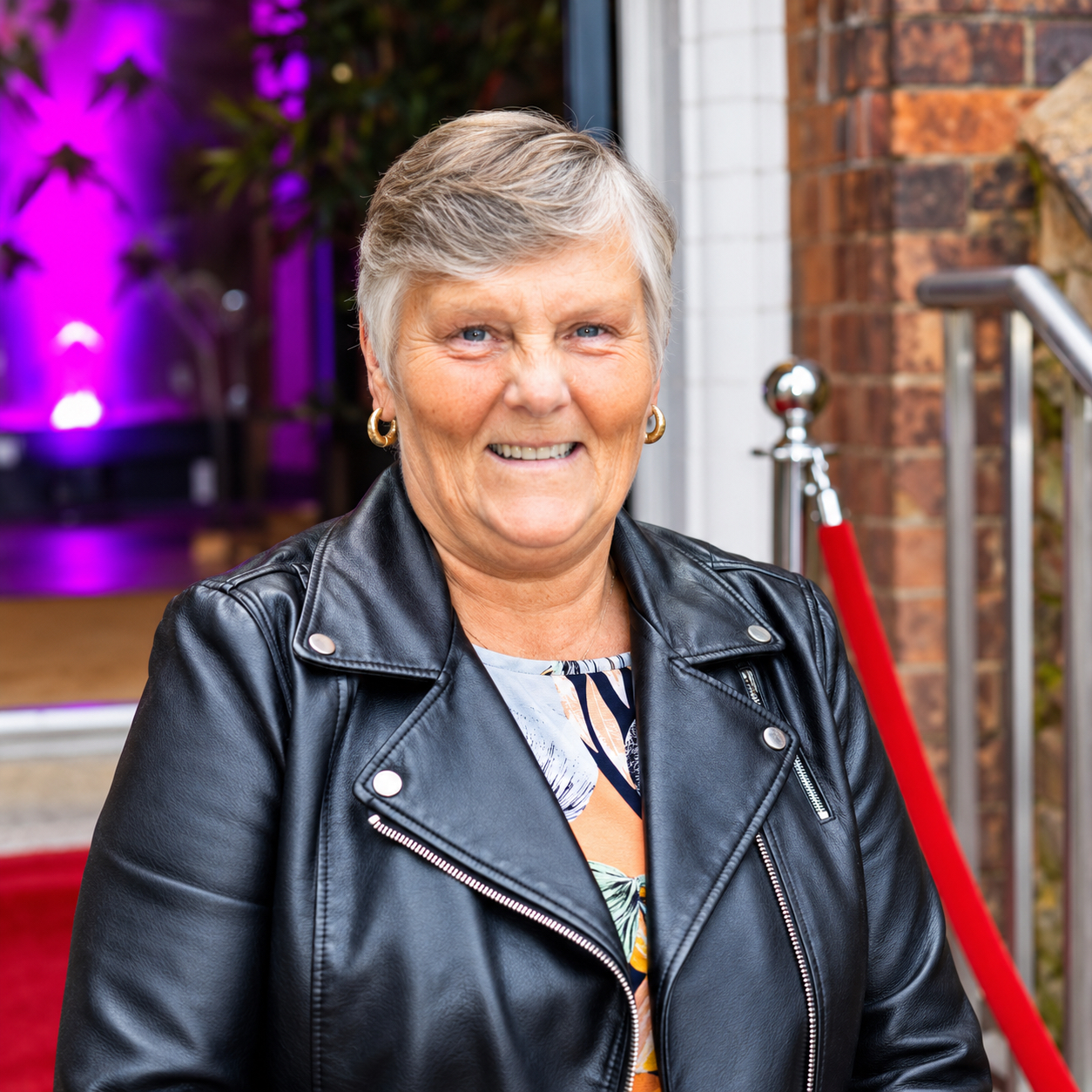 Gail smiling in a black leather jacket